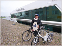 Glynis with Silver Travel Bag and the bicycle!