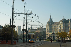 Trams add to the atmosphere – Golden Bull Hotel on right
