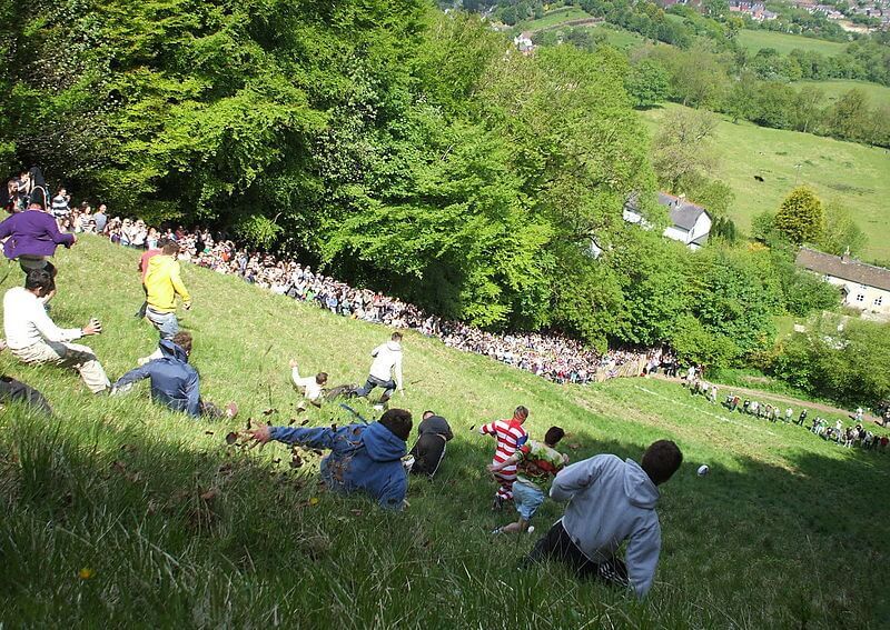 A race at The Cooper's Hill Cheese Rolling and Wake on 27th May 2013 by Dave Farrance CC BY-SA 3.0 https://creativecommons.org/licenses/by-sa/3.0