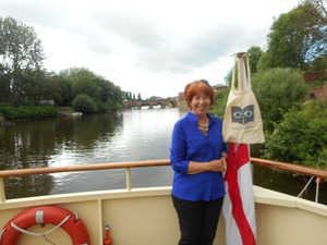 Glynis with the Silver Travel bag on the prow