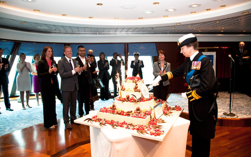 HRH The Princess Royal cuts a cake specially baked by celebrity pattissier Eric Lanlard at P&amp;O Cruises 175th celebrations