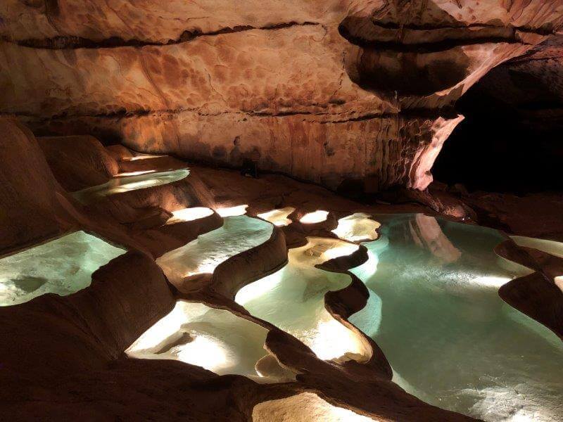Light show on the basins inside Grotte Saint Marcel d'Ardeche
