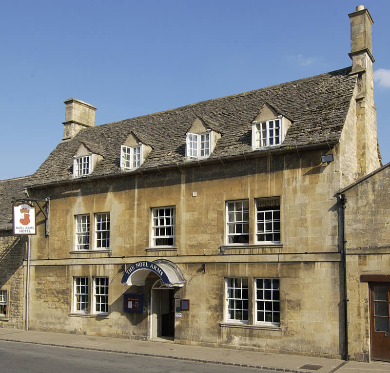 The Cotswolds stone facade of the Noel Arms in Chipping Camden