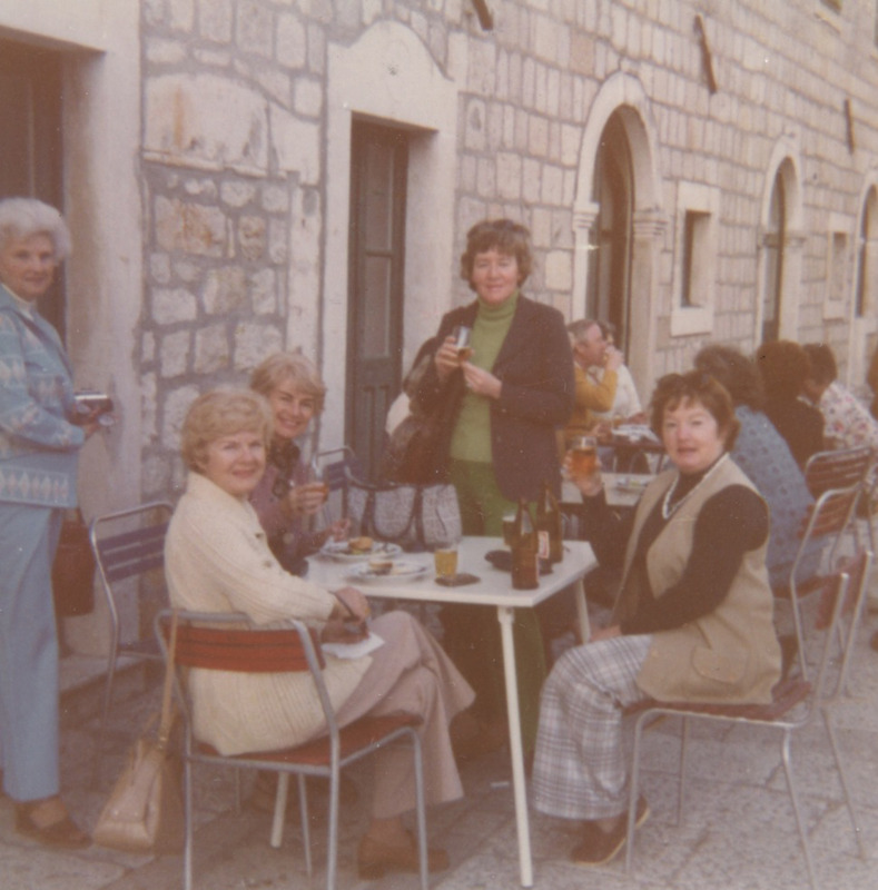 May 1977 (former) Yugoslavia  Betty is the one standing in the centre wearing a navy blazer, green top and green pants. She is pictured among travel agents.