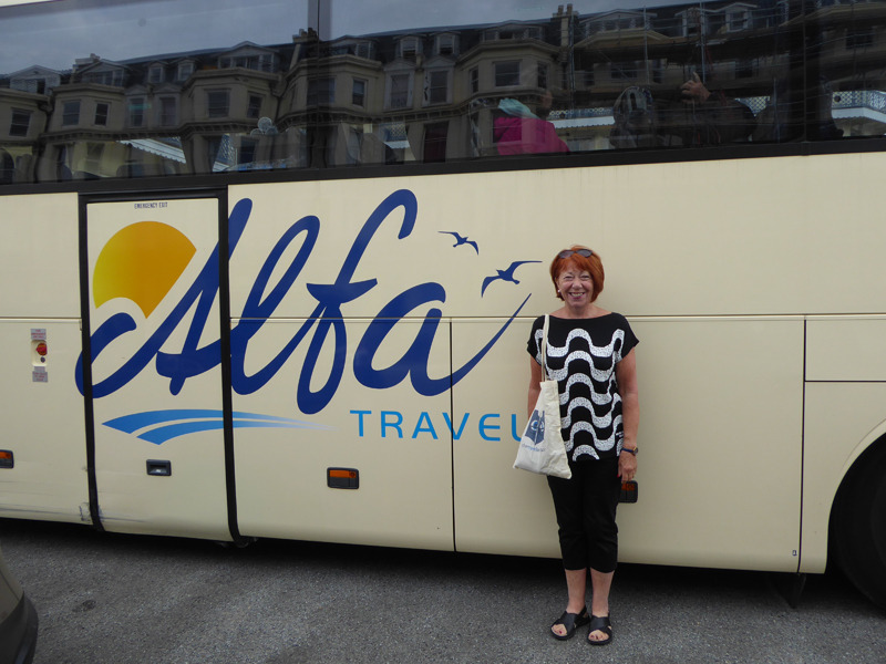 Glynis outside the Alfa Coach with the Silver Travel bag