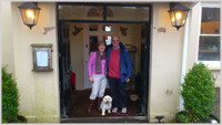 Pam and husband Steve with their little dog Rosie