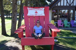 Petra in an Adirondack chair in Riding Mountain National Park