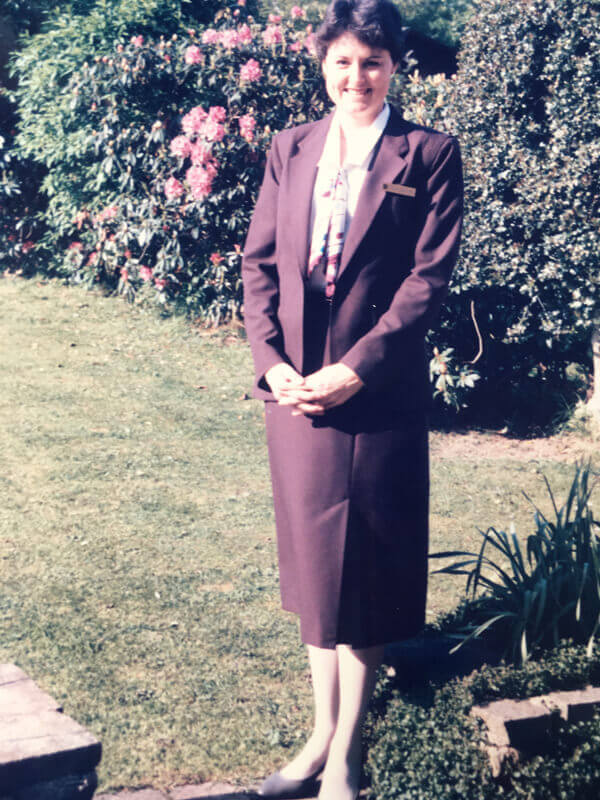 Sally Dowling as Continental Airlines stewardess in 1985