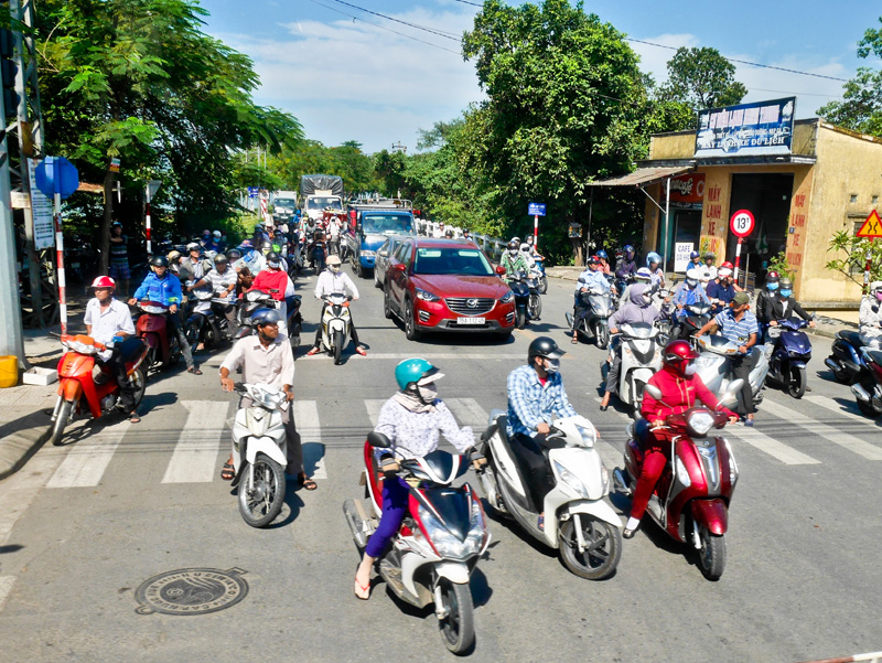 Scooters at Level Crossing