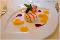 Mandarin parfait with a light lemon cream, raspberry jelly and white and dark chocolate