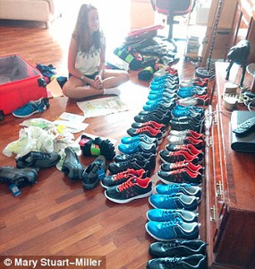 Mary's youngest daughter Tilly pairs up new trainers for the refugees.