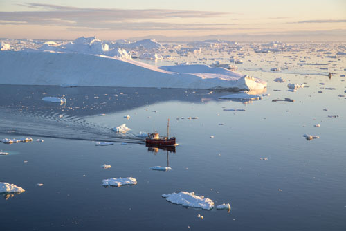iStock-1302439278---Red-Fishing-Boat-in-Ilulissat-Icefjrod---WEB
