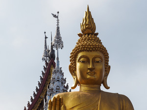 Buddha statues watch over daily life in Thailand and Laos