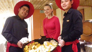 Staff welcoming diners in red Spanish hats
