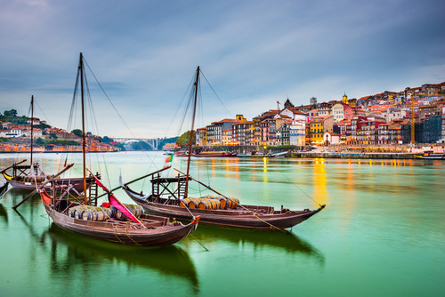 Porto - old town cityscape on the Douro river with traditional Rabelo boats - Shutterstock, courtesy of Jules Verne