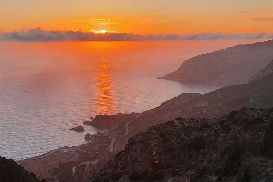 Beautiful sunset over the Aegean Sea seen from the village of Pyles thanks to Vena Kamaratos
