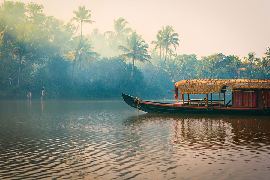 A traditional house boat anchored in the popular area known as the Backwaters