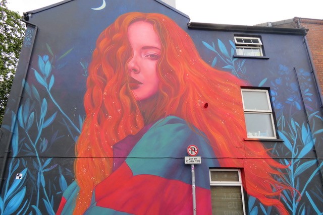 Red-haired woman in the moonlight street art