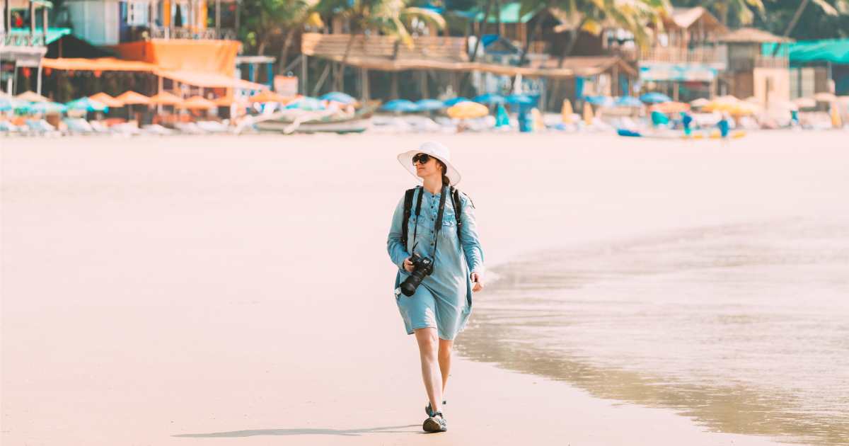 Canacona, Goa, India. Young Caucasian Lady Woman With Camera Walking Along Seashore On Palolem Beach | Solo Travel Holidays