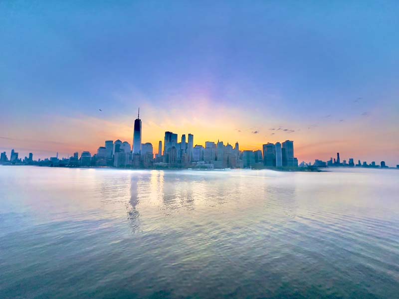 First view of the Manhatten skyline emerging from morning mists