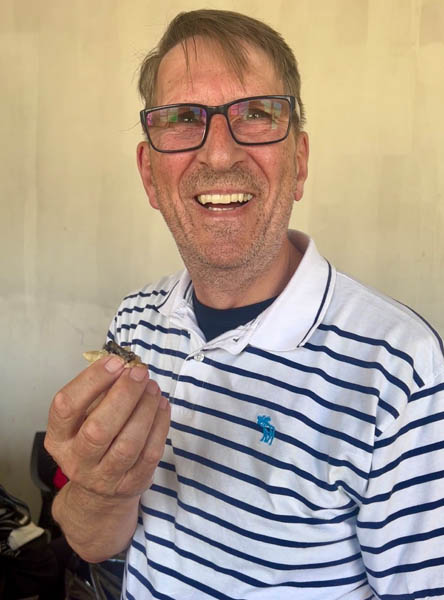 Paul tucks into a mopane worm