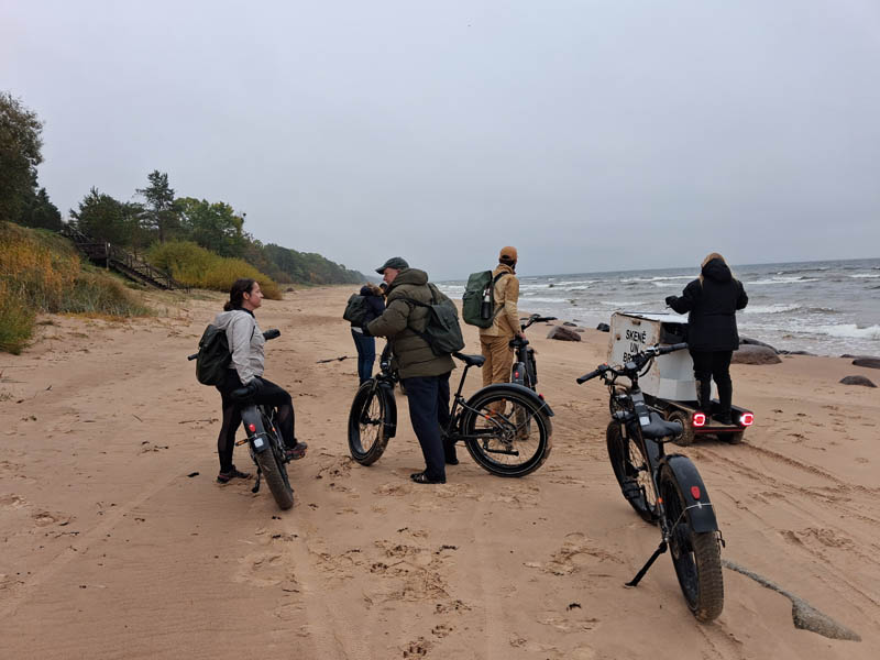 cycling along the beach with electric bikes