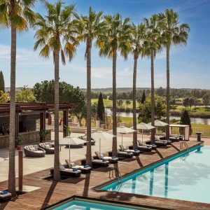 Victoria_Golf_Resort_&_Spa_Main_Pool_Palms_Bar_Wide_Hero