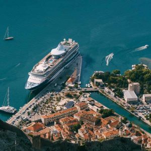Cruise ship at the pier of the old town of Kotor. View from Mount Lovcen | Types of Cruise Holidays