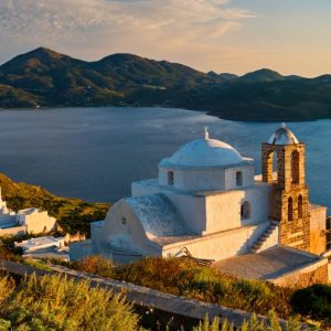Greek Orthodox church in Plaka village on Milos island on sunset in Greece